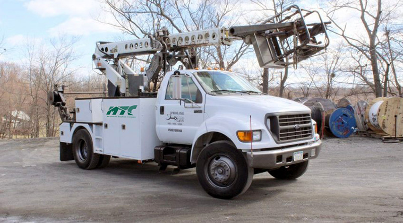 17-8-blog-feature-1 A white MTC truck with a bucket.