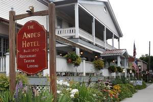 The Andes Hotel is featured. The sign is in the foreground and the building behind it.