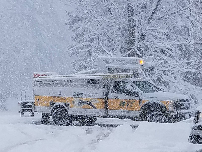 A very snowy day is pictured with an MTC truck as the main focus.