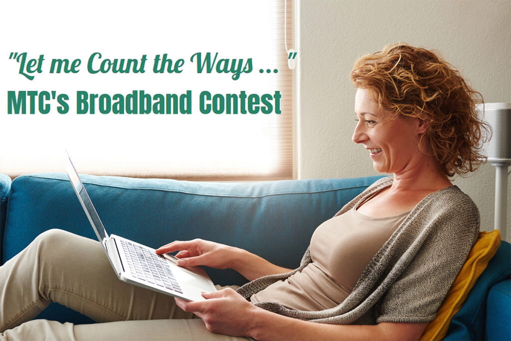 Woman lying on sofa with laptop smiling Woman relaxing on a couch using a laptop to promote MTC’s broadband contest.
