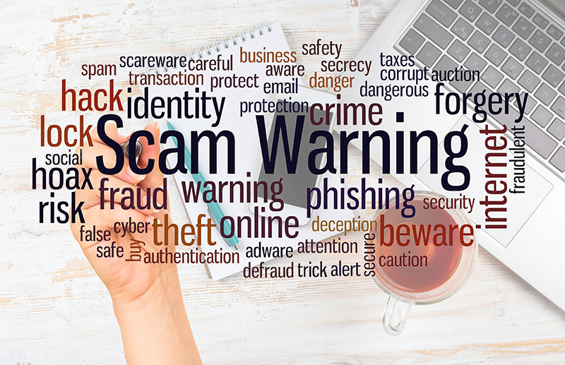 23-3-blog-feature-4 A word map featuring scams in front of a laptop and coffee.